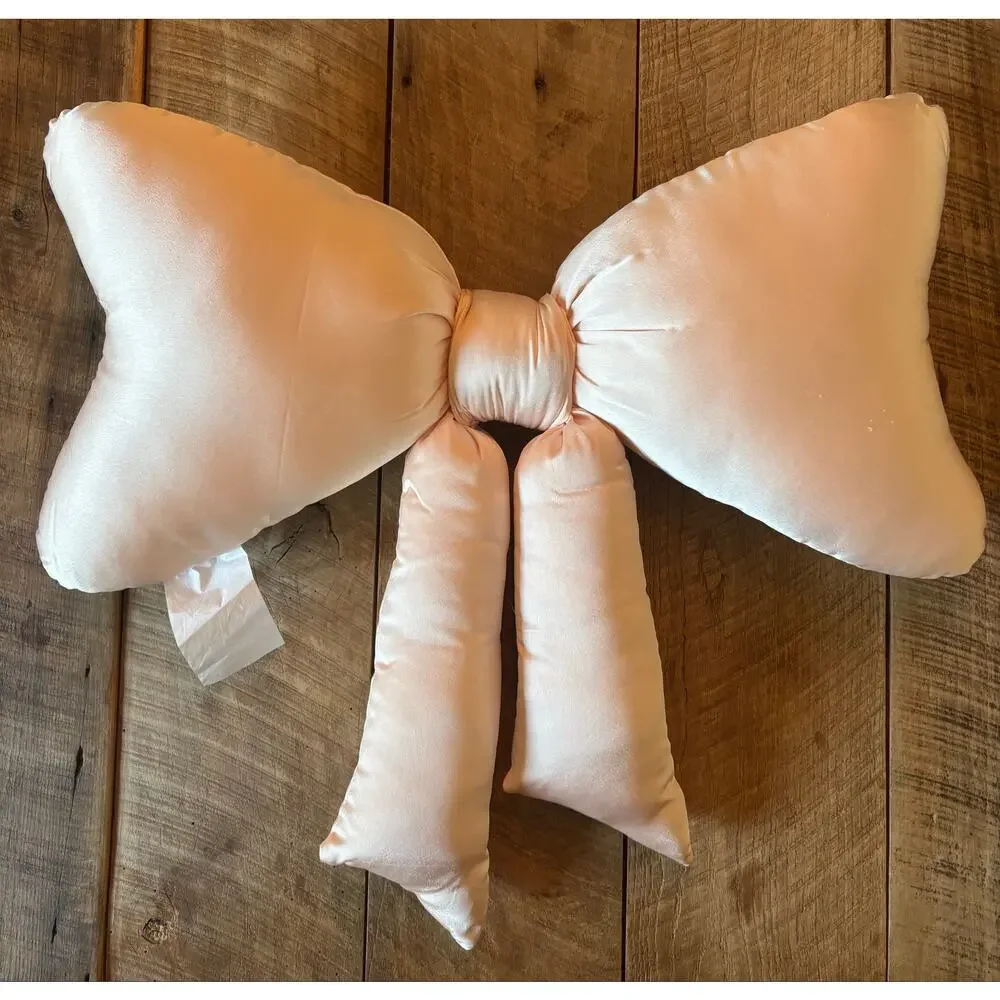 URBAN OUTFITTERS HOME light pink satin “BOW” throw pillow